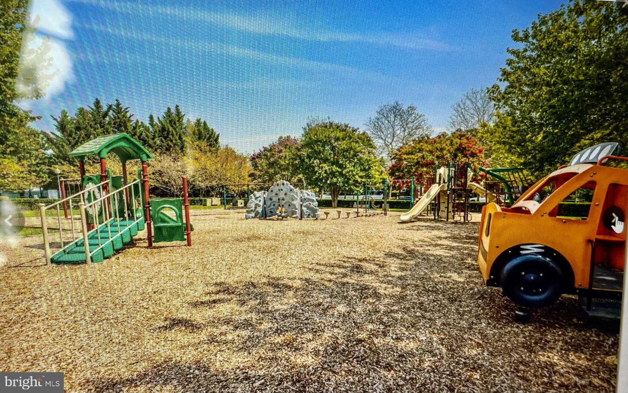 102 Kendrick Place, Unit 10222 Gaithersburg, MD 20878 - Photo 15 of 17 a view of outdoor space and car parked
