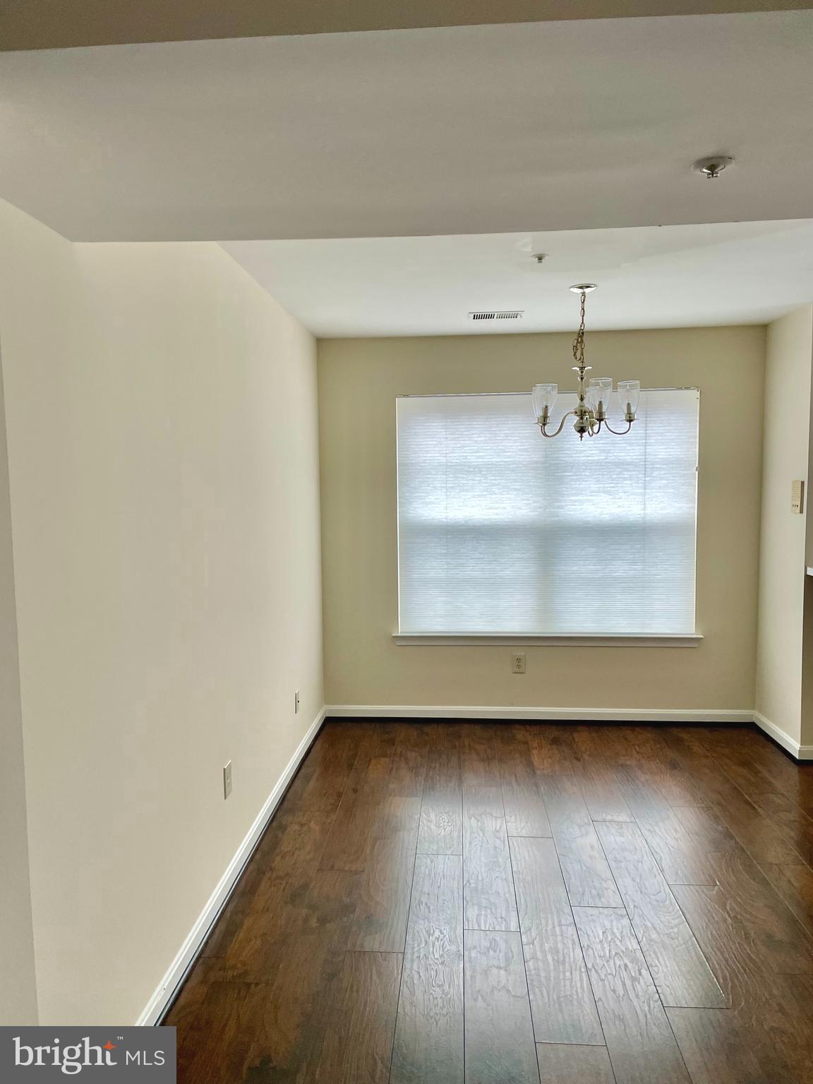102 Kendrick Place, Unit 10222 Gaithersburg, MD 20878 - Photo 6 of 17 a view of room with window and wooden floor