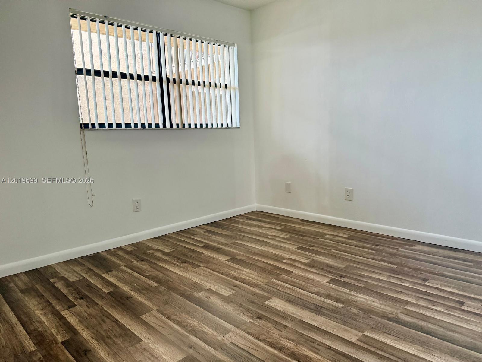 3470 Foxcroft Road, Unit 204 Miramar, FL 33025 - Photo 20 of 40 a view of a room with wooden floor and a window