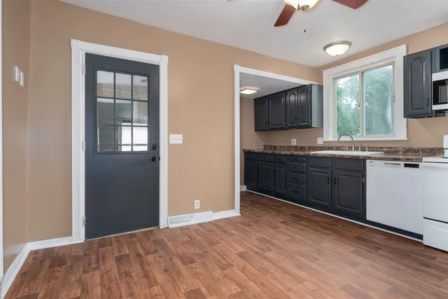 a kitchen with a sink and a window