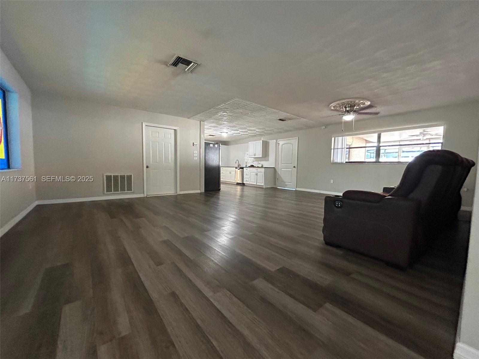 7403 Foxbloom Drive Port Richey, FL 34668 - Photo 36 of 45 a view of kitchen with furniture and wooden floor