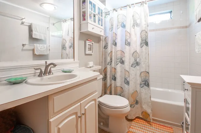 a bathroom with a sink toilet a shower and a bathtub
