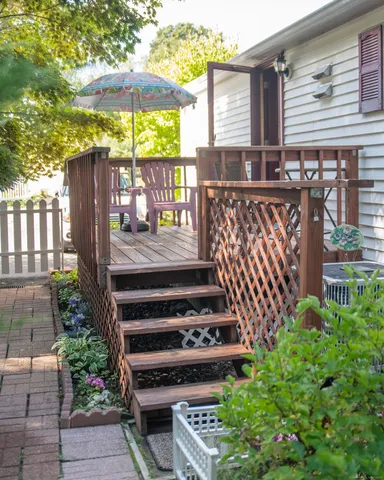 a view of a garden with a deck