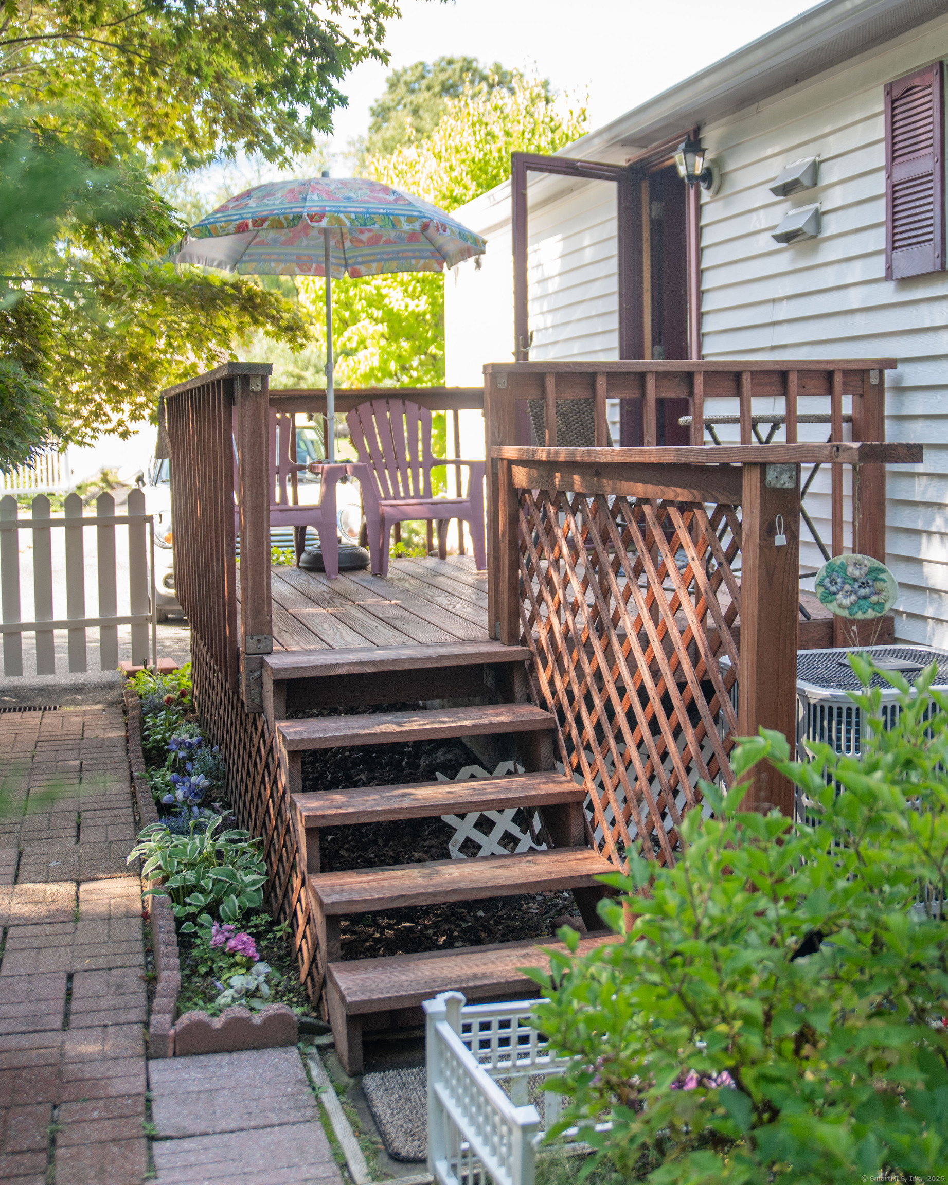 26 Crescent Park Road Westport, CT 06880 - Photo 18 of 23 a view of a garden with a deck