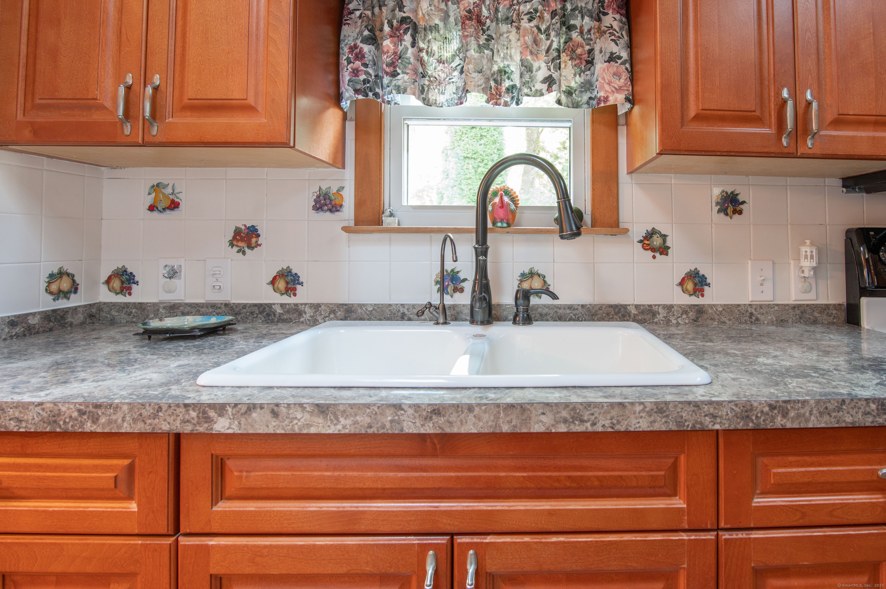 26 Crescent Park Road Westport, CT 06880 - Photo 2 of 23 a bathroom with sink granite and a mirror