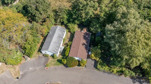 an aerial view of a house with a yard and a garden