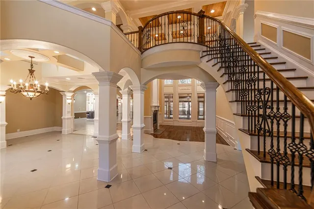 a view of an empty room with a fireplace and a window
