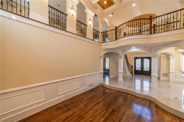 a bathroom with a tub a double vanity sink and a mirror