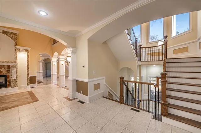 a view of a livingroom with a fireplace and window
