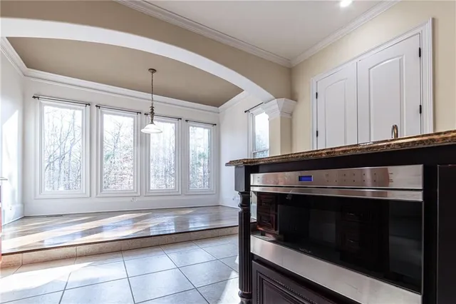 a view of a livingroom with a ceiling fan and window