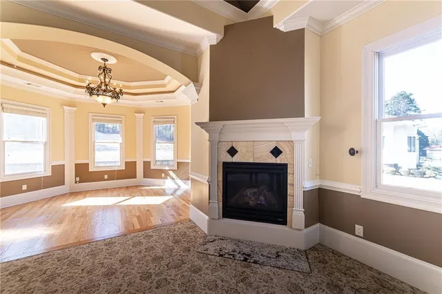 a view of hallway with wooden floor