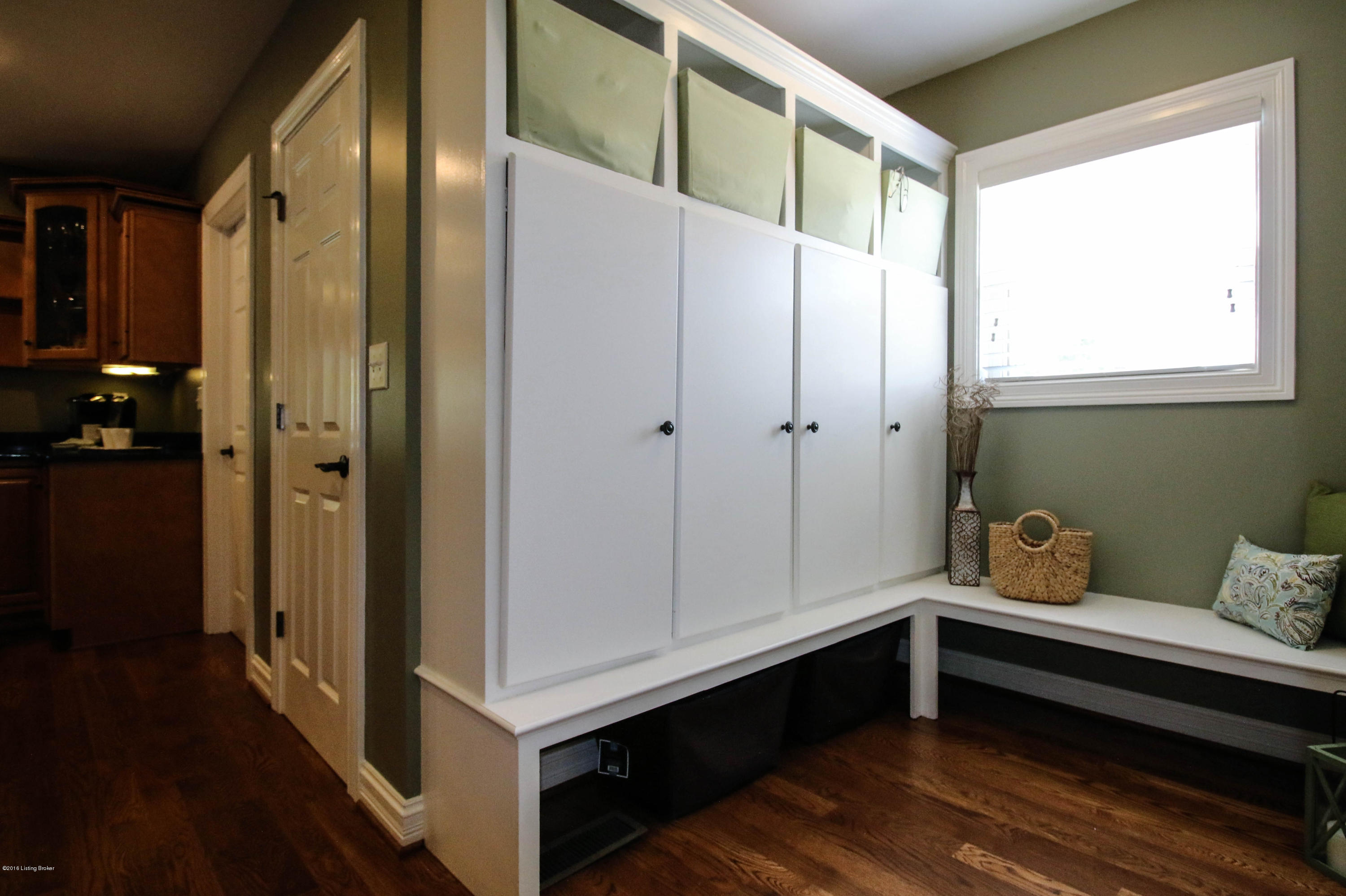 2904 Doe Ridge Court Prospect, KY 40059 - Photo 15 of 86 A dedicated laundry room is housed off the kitchen. Just around the corner is a handy transitional space with a bench, closed storage, and cubbies.