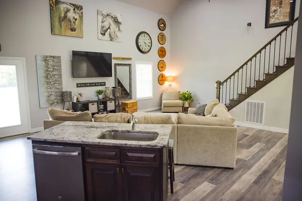 a bedroom with bed and a couch