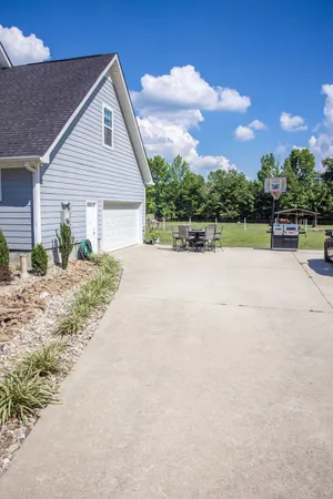 a view of pool with small yard