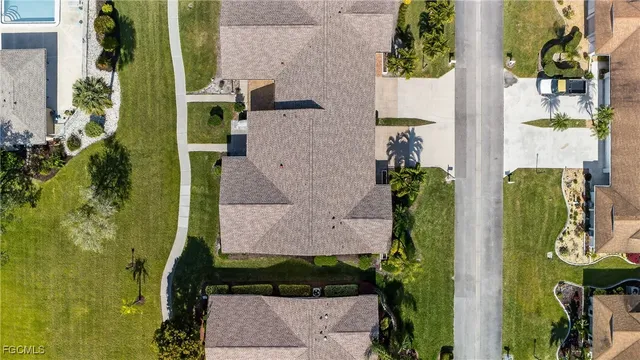 an aerial view of residential houses with outdoor space