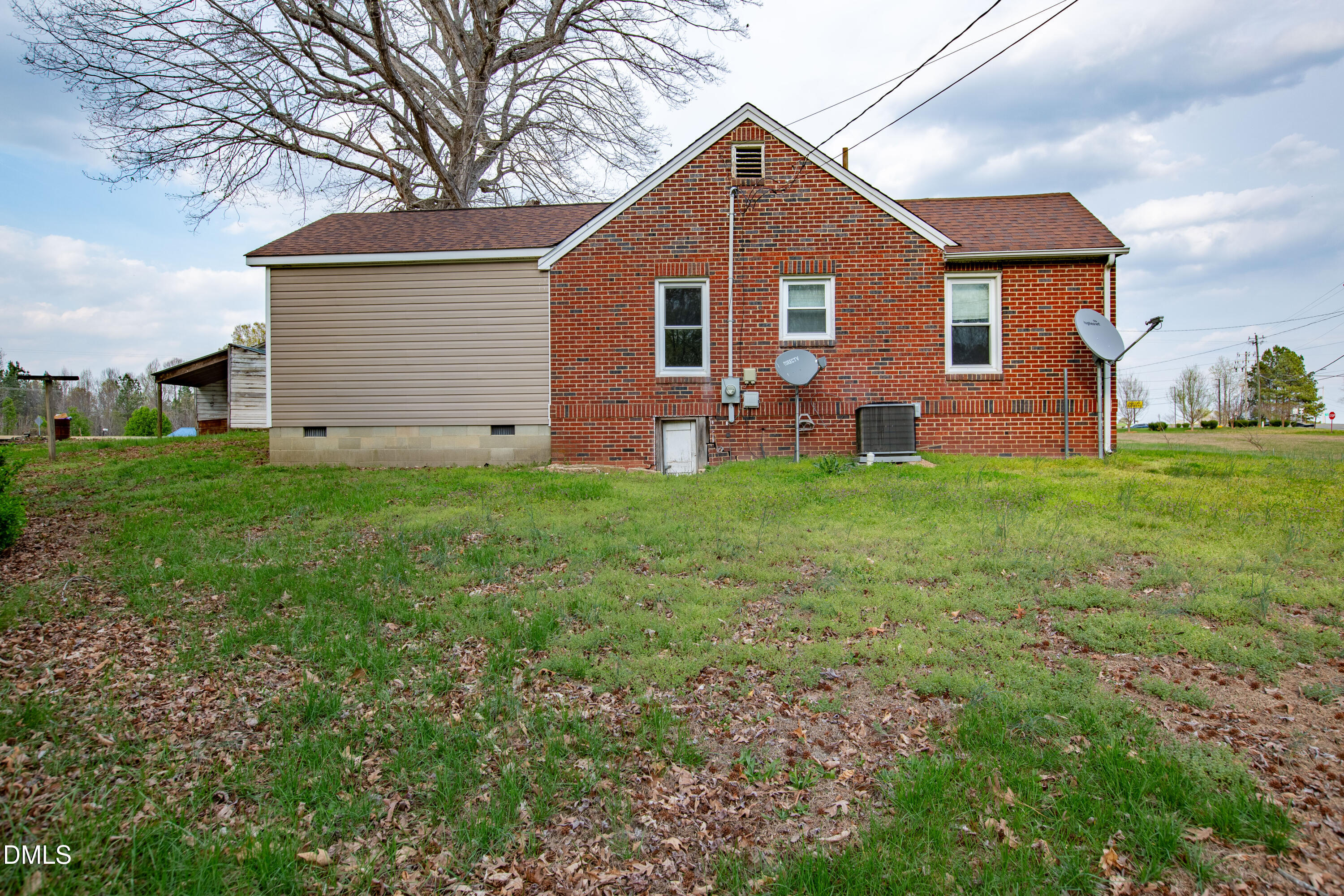 4295 Virgilina Road Roxboro, NC 27574 - Photo 40 of 46 a front view of a house with a garden