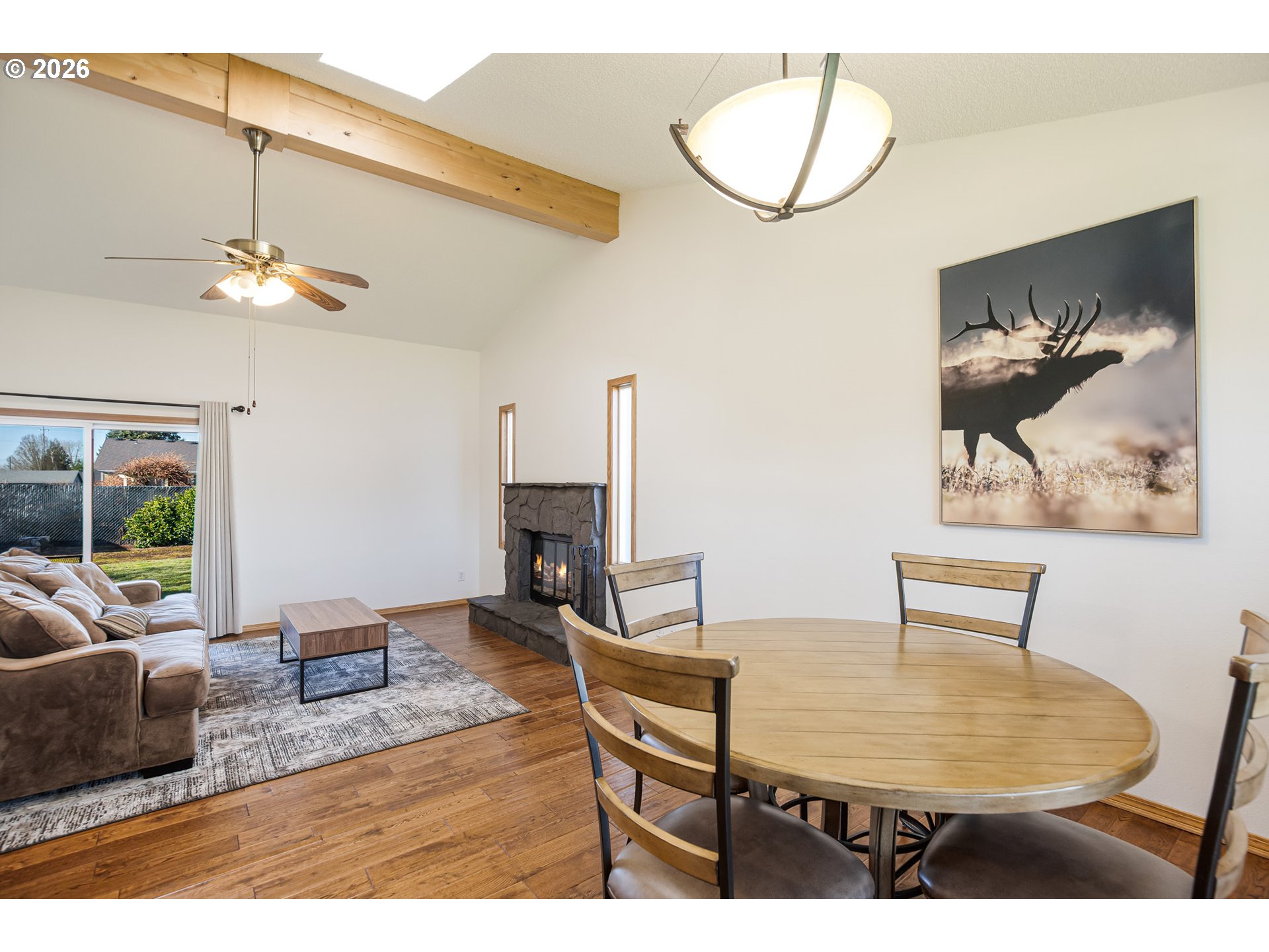 913 South Fir Court Canby, OR 97013 - Photo 12 of 37 a living room with furniture and a chandelier