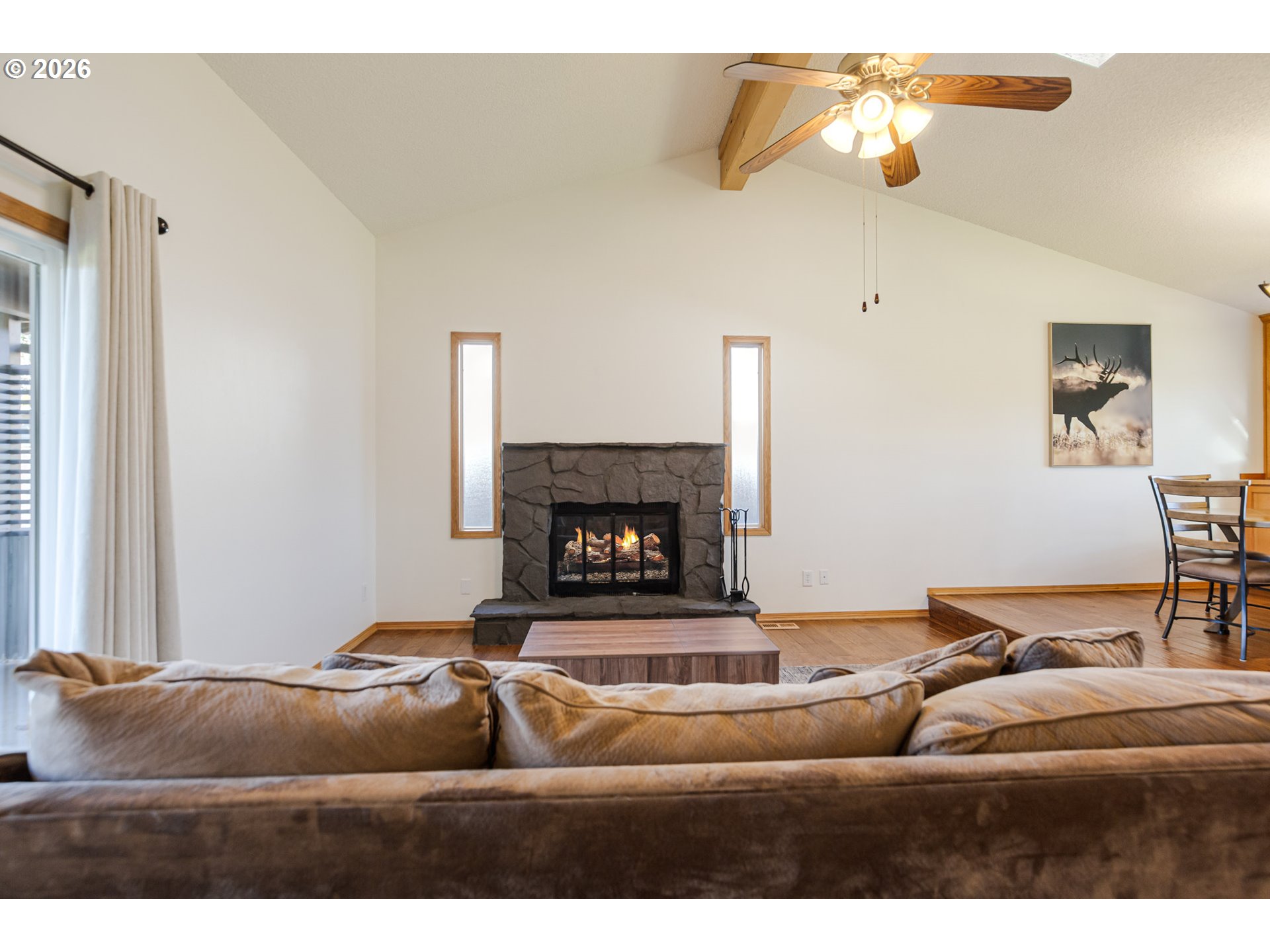 913 South Fir Court Canby, OR 97013 - Photo 14 of 37 a living room with furniture and a fireplace