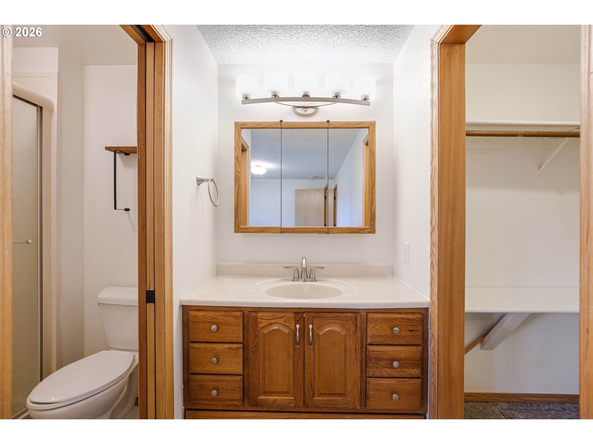 913 South Fir Court Canby, OR 97013 - Photo 20 of 37 a bathroom with a sink vanity mirror and toilet