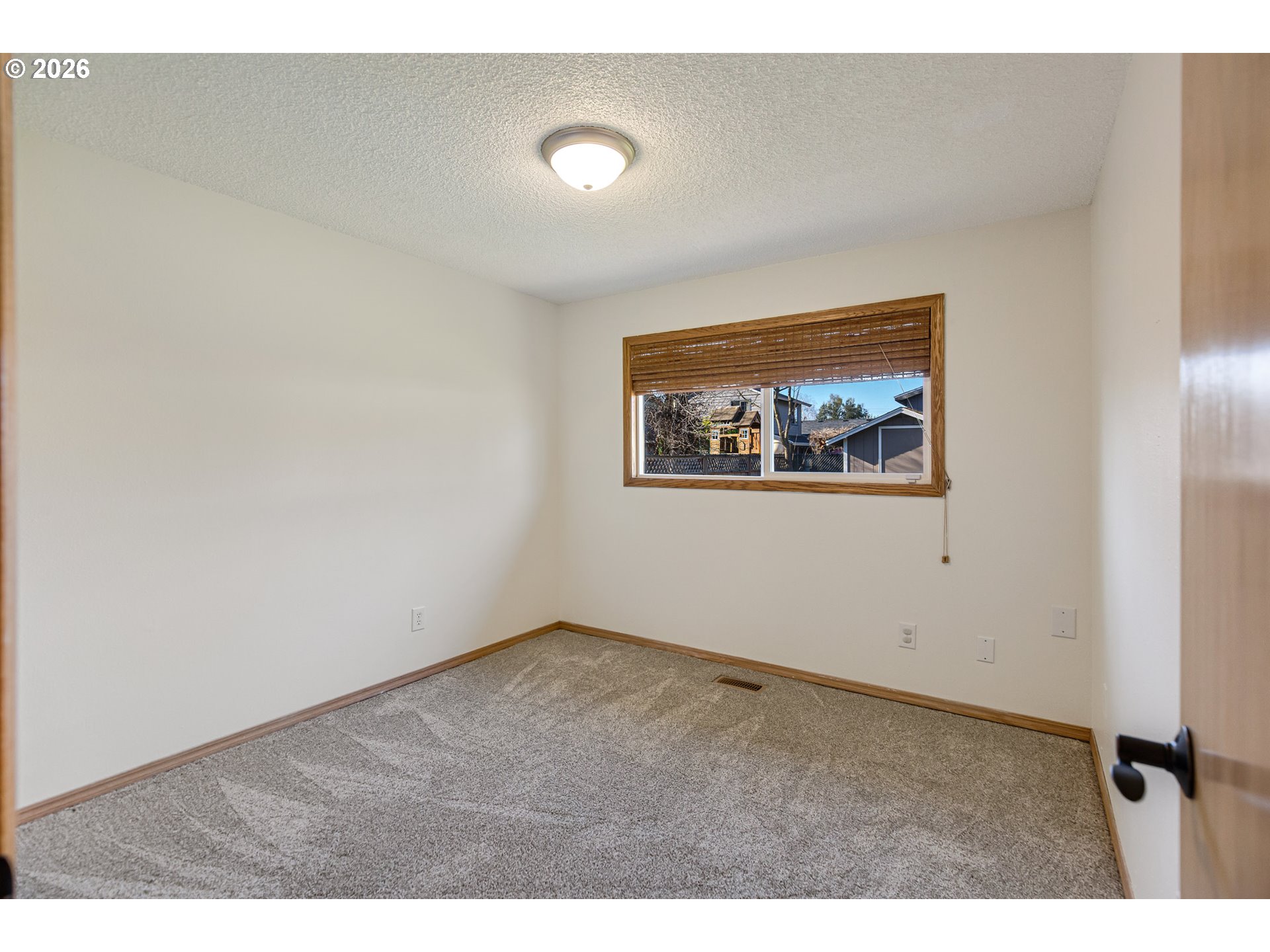 913 South Fir Court Canby, OR 97013 - Photo 24 of 37 a view of an empty room with a window