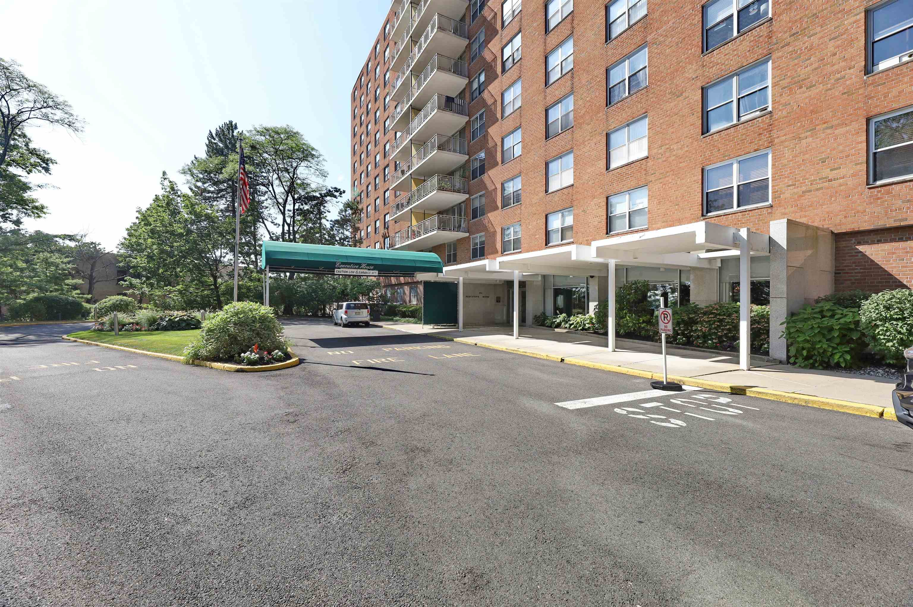 301 Beech Street, Unit 7A Hackensack, NJ 07601 - Photo 11 of 11 a view of a building with a garden and pathway