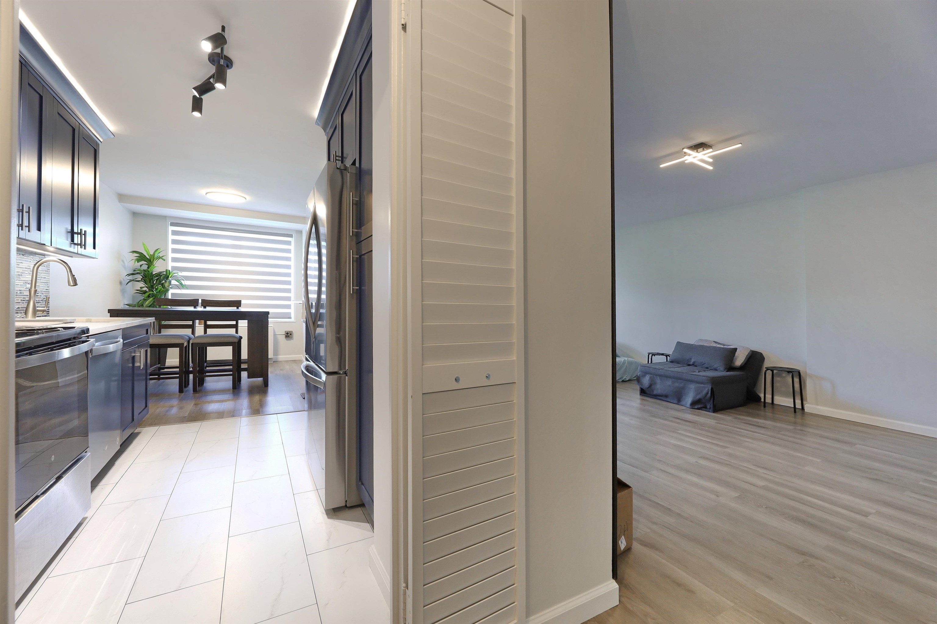 301 Beech Street, Unit 7A Hackensack, NJ 07601 - Photo 2 of 11 a hallway with dining table and chairs