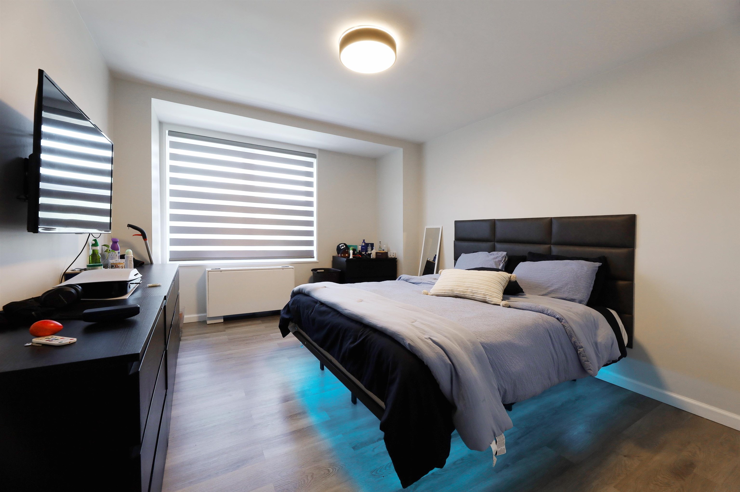 301 Beech Street, Unit 7A Hackensack, NJ 07601 - Photo 4 of 11 a bedroom with a bed and a window