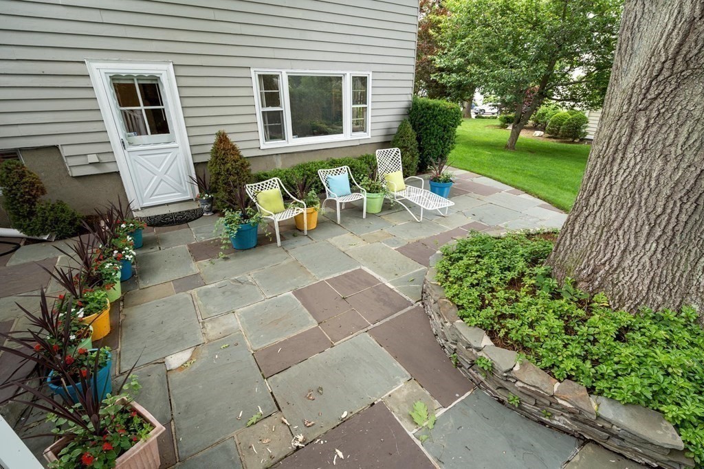 30 Burdean Road Newton, MA 02459 - Photo 27 of 29 a view of a house with backyard sitting area and garden