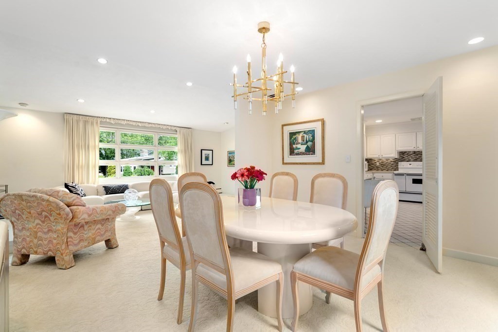 30 Burdean Road Newton, MA 02459 - Photo 9 of 29 a view of a dining room with furniture a chandelier and a window
