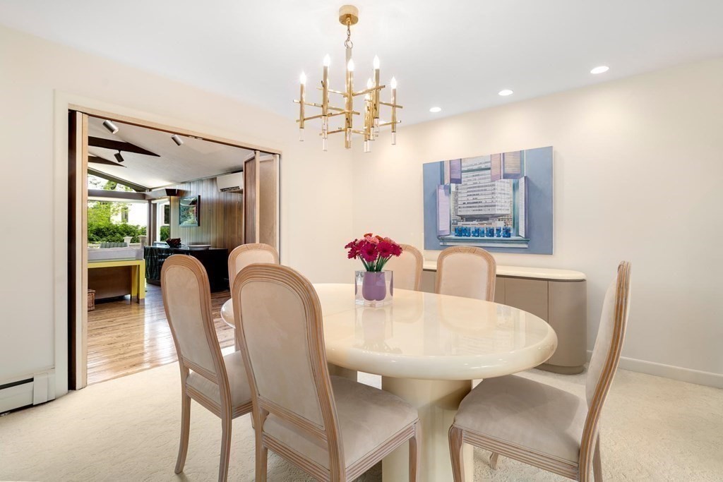 30 Burdean Road Newton, MA 02459 - Photo 10 of 29 a view of a dining room with furniture and chandelier