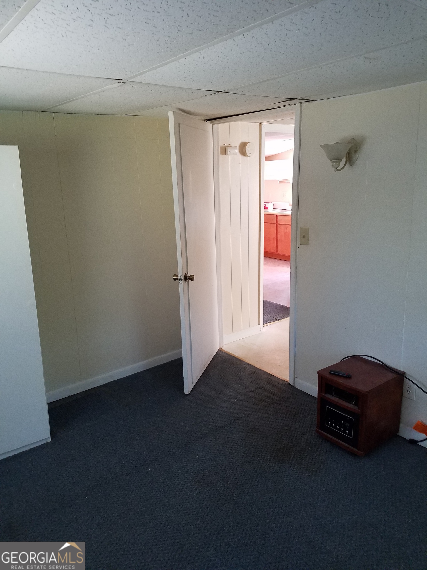 7 David Drive, Unit B Hampton, GA 30228 - Photo 13 of 14 a view of an empty room with a window