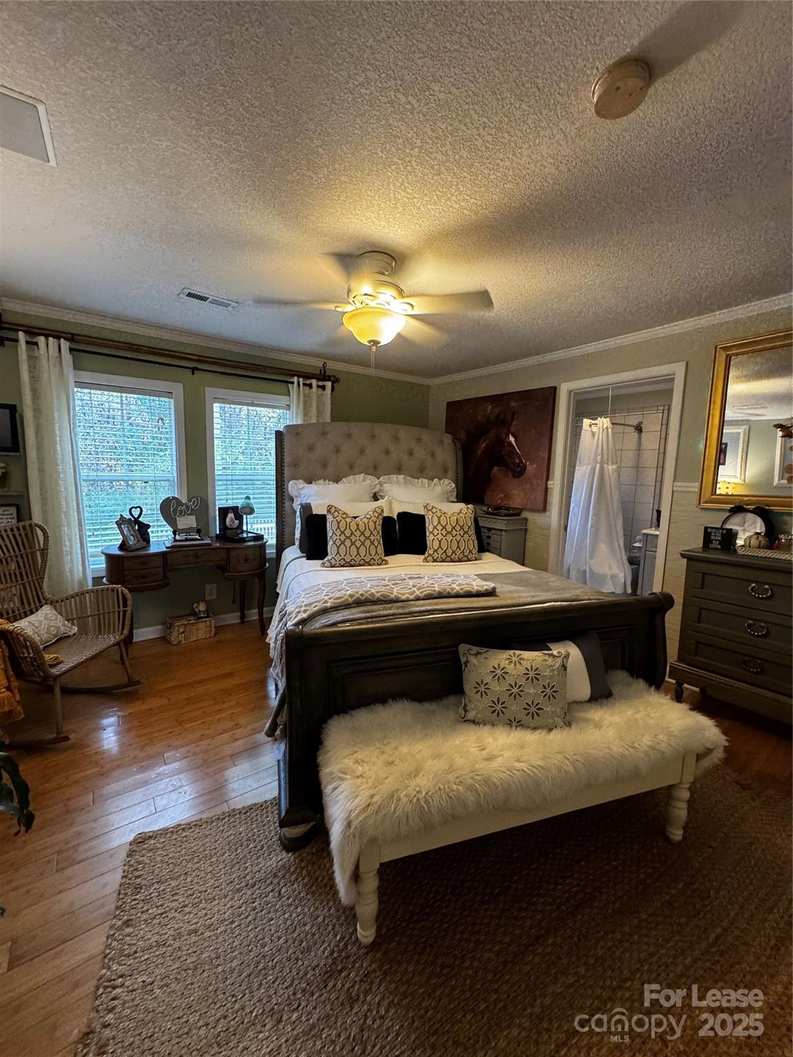 404 Moss Springs Road Albemarle, NC 28001 - Photo 18 of 33 a bedroom with furniture and wooden floor