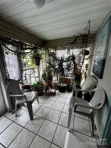 a view of a backyard with large trees
