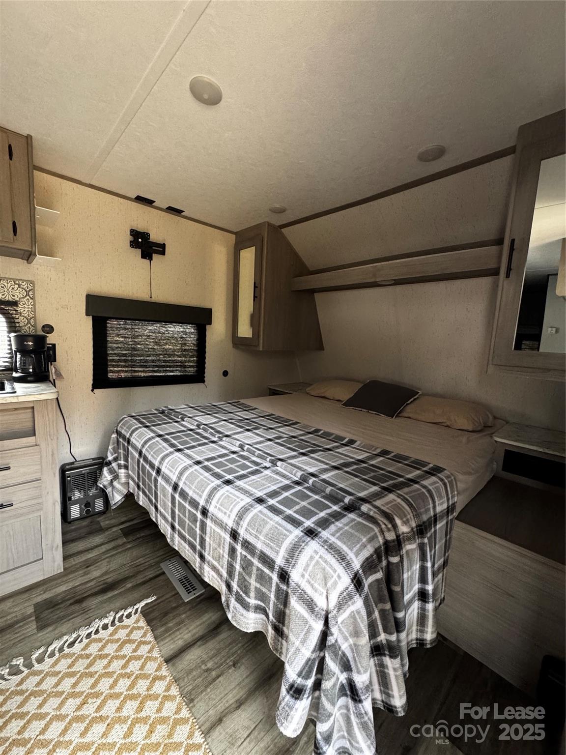 404 Moss Springs Road Albemarle, NC 28001 - Photo 28 of 33 a bedroom with a bed and a mirror