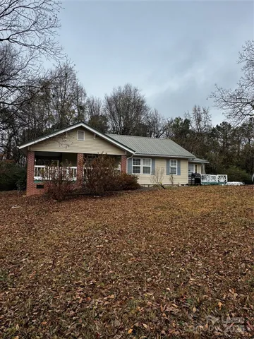 a view of house with wooden fence