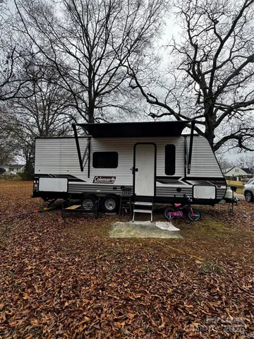 a view of a wooden deck with a trees