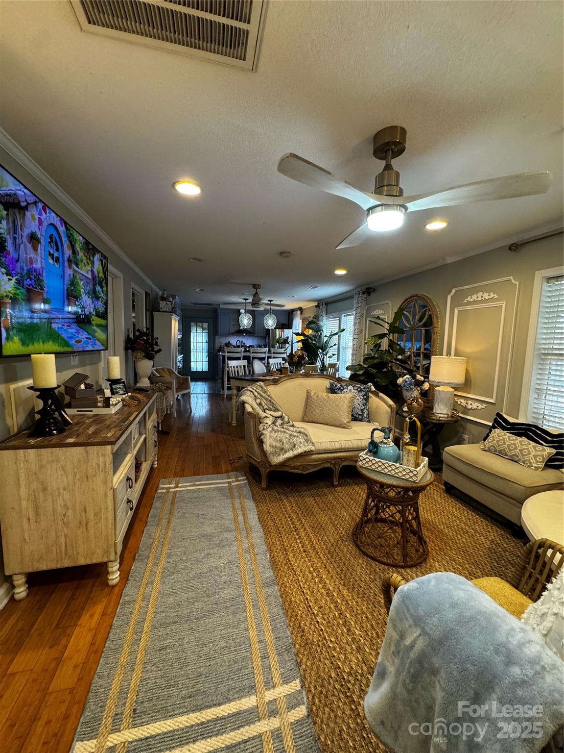 404 Moss Springs Road Albemarle, NC 28001 - Photo 7 of 33 a living room with lots of furniture and a rug