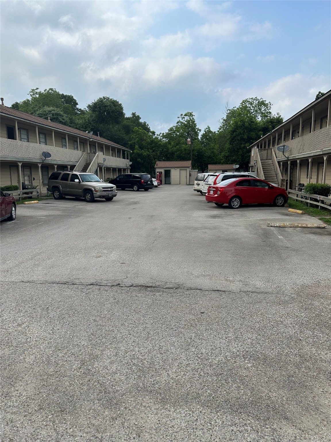 201 Sands Street, Unit 19 Angleton, TX 77515 - Photo 6 of 6 a car parked on the side of the road