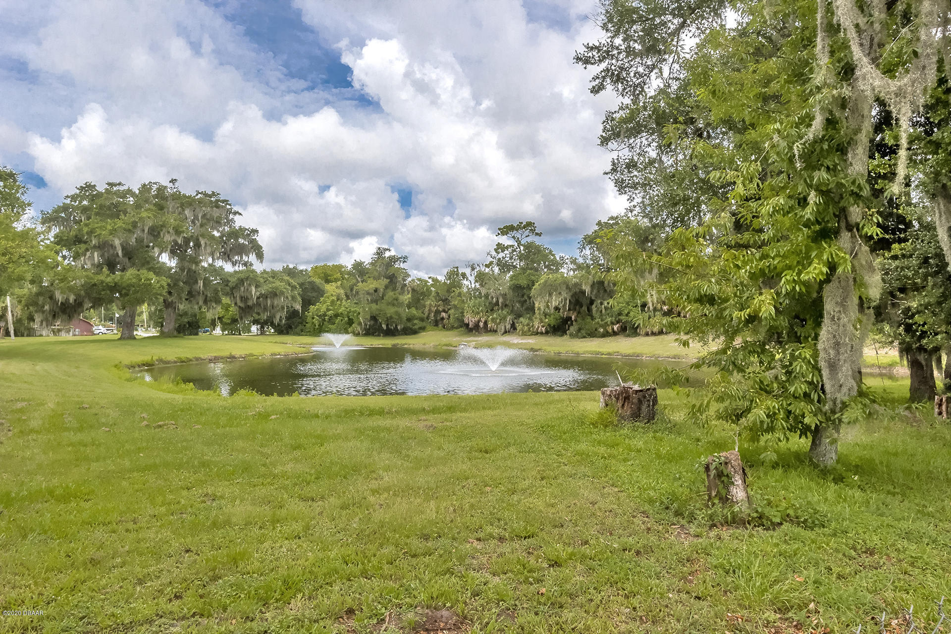 1028 Cherokee Ranch Road Holly Hill, FL 32117 - Photo 2 of 34 Lake/Pond behind home