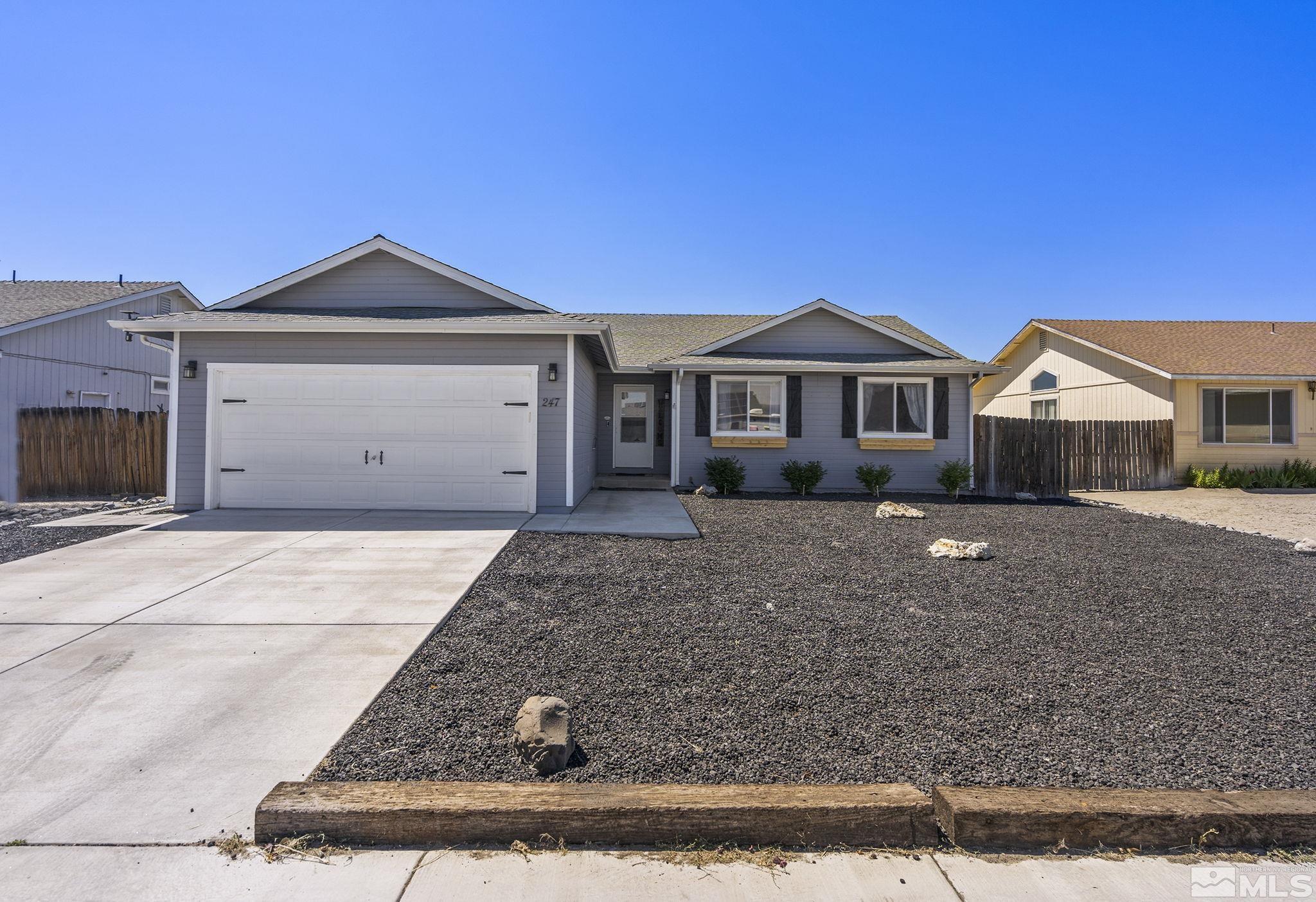 a front view of a house with yard