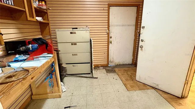 a view of a bathroom with wooden floor and a door