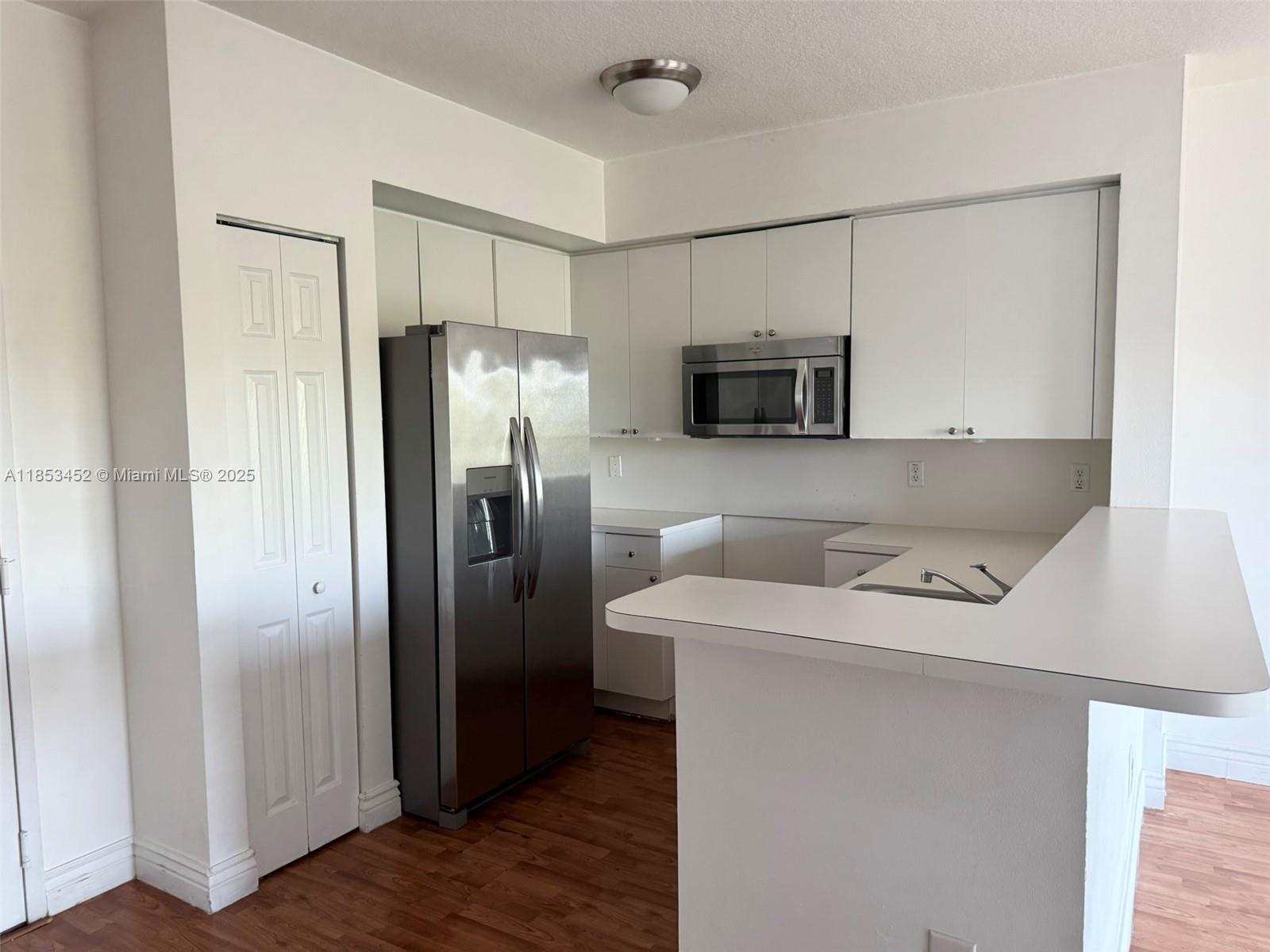 11060 Southwest 196th Street, Unit 512 Cutler Bay, FL 33157 - Photo 4 of 19 a utility room with washer and dryer
