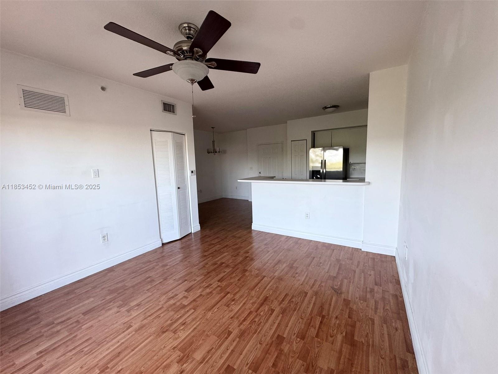 11060 Southwest 196th Street, Unit 512 Cutler Bay, FL 33157 - Photo 9 of 19 a view of empty room with wooden floor
