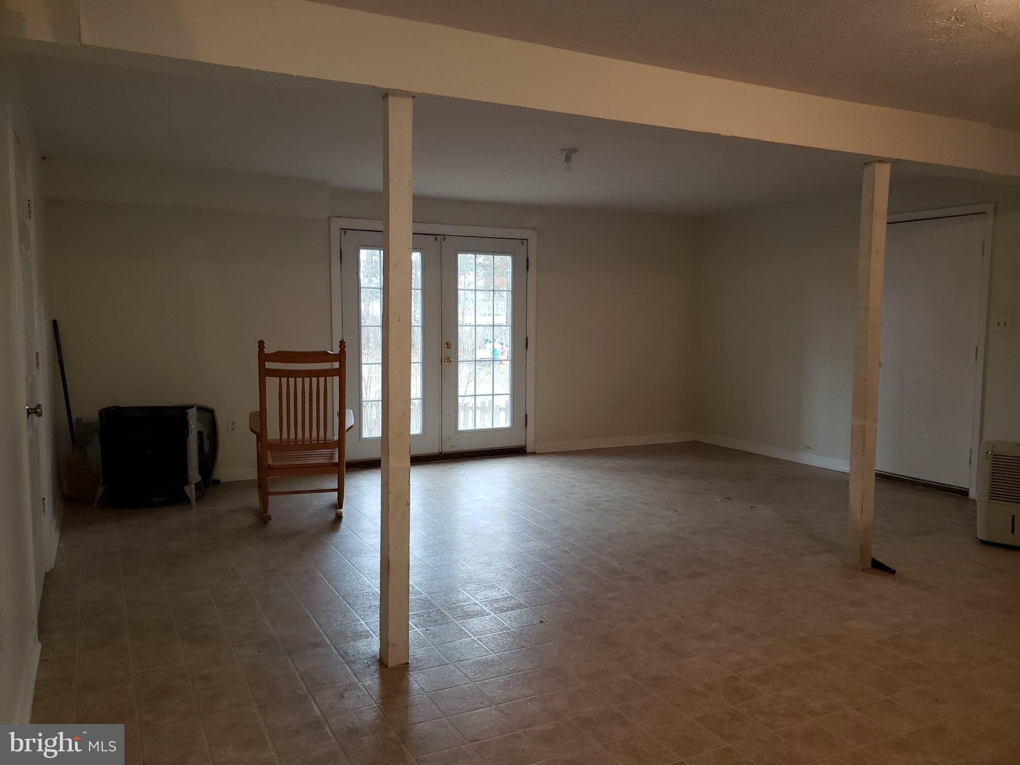 215 Ridgefield Avenue Stephens City, VA 22655 - Photo 3 of 21 Partially finished basement with outside access.