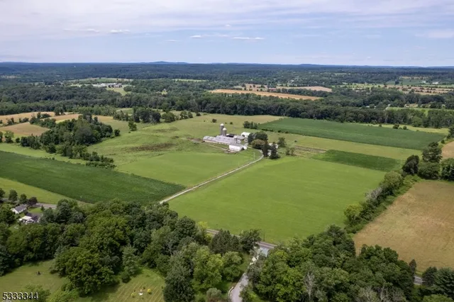 an aerial view of a houses with a yard