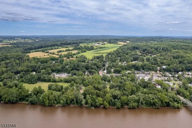 an aerial view of a houses with ocean view