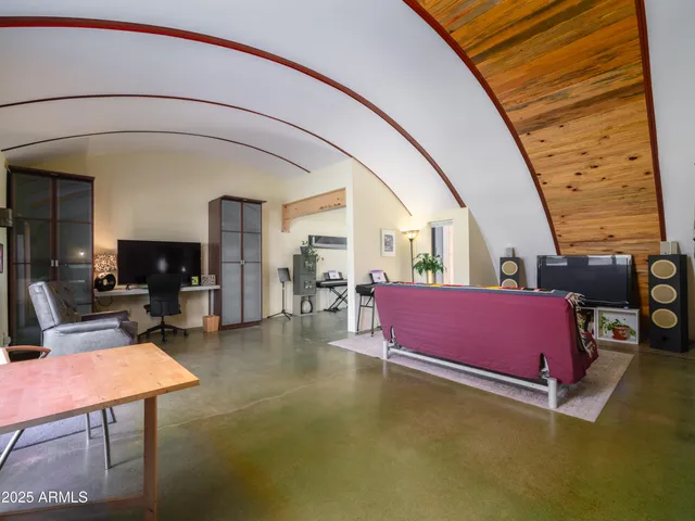 a living room with furniture and flat screen tv