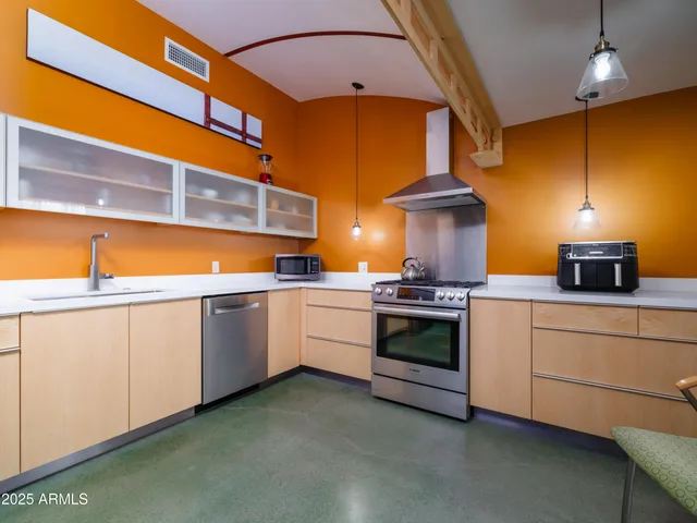 a kitchen with table and chairs
