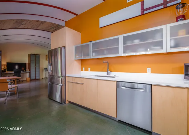 a view of a hallway with washer and dryer