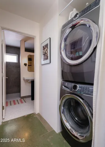 a bathroom with a sink a mirror and shower